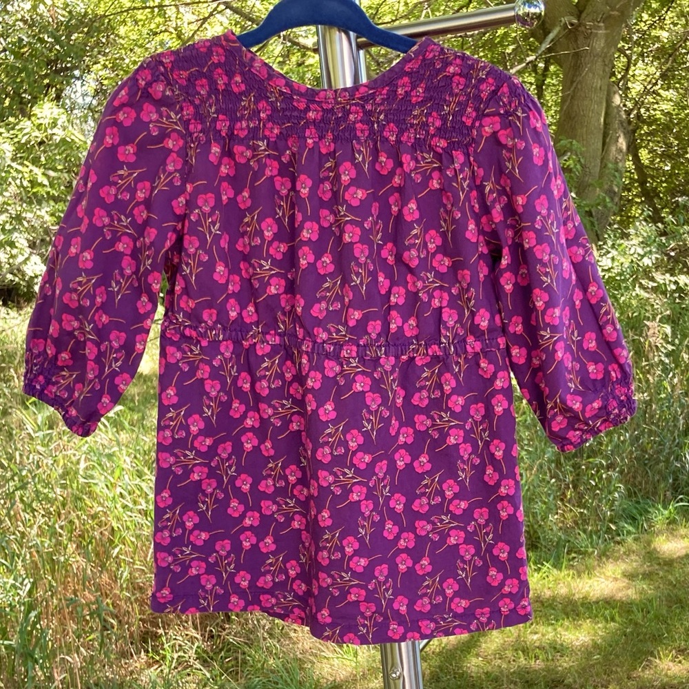 Peek: 12-18 months purple dress w/ pink flowers and smocking.